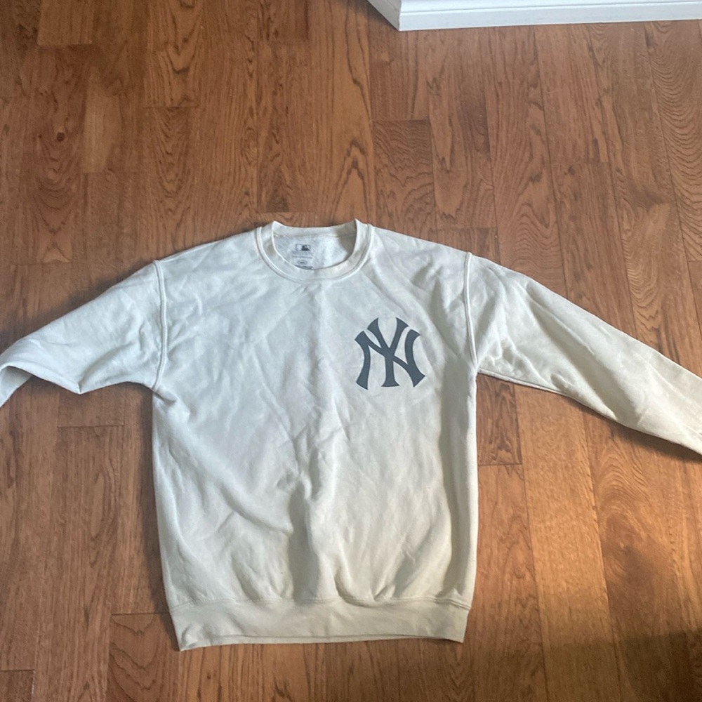 Cream coloured yankee crew neck, size medium.